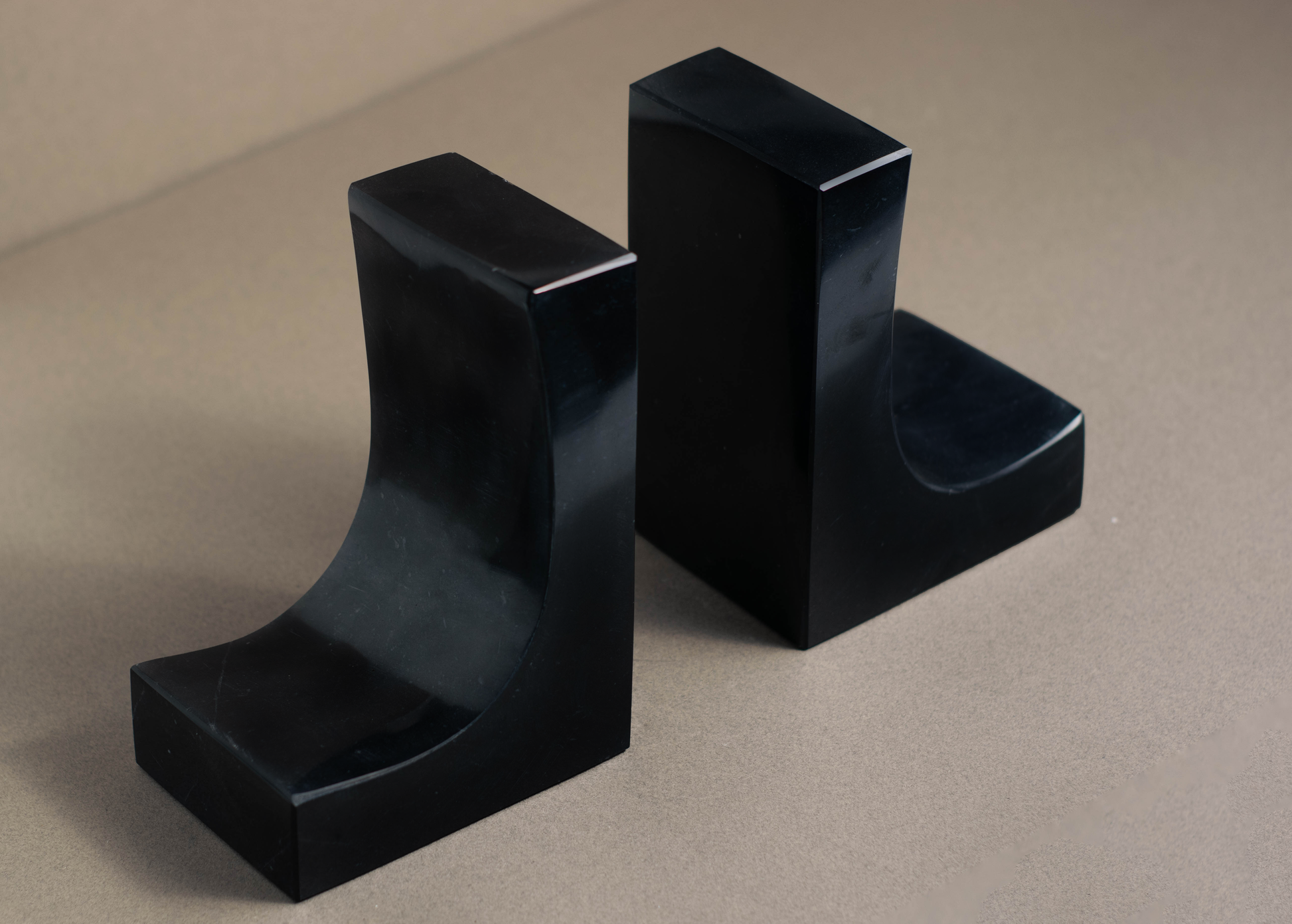 Handcrafted Ascend Black Marble Bookends with polished finish and natural veining for stylish home décor.