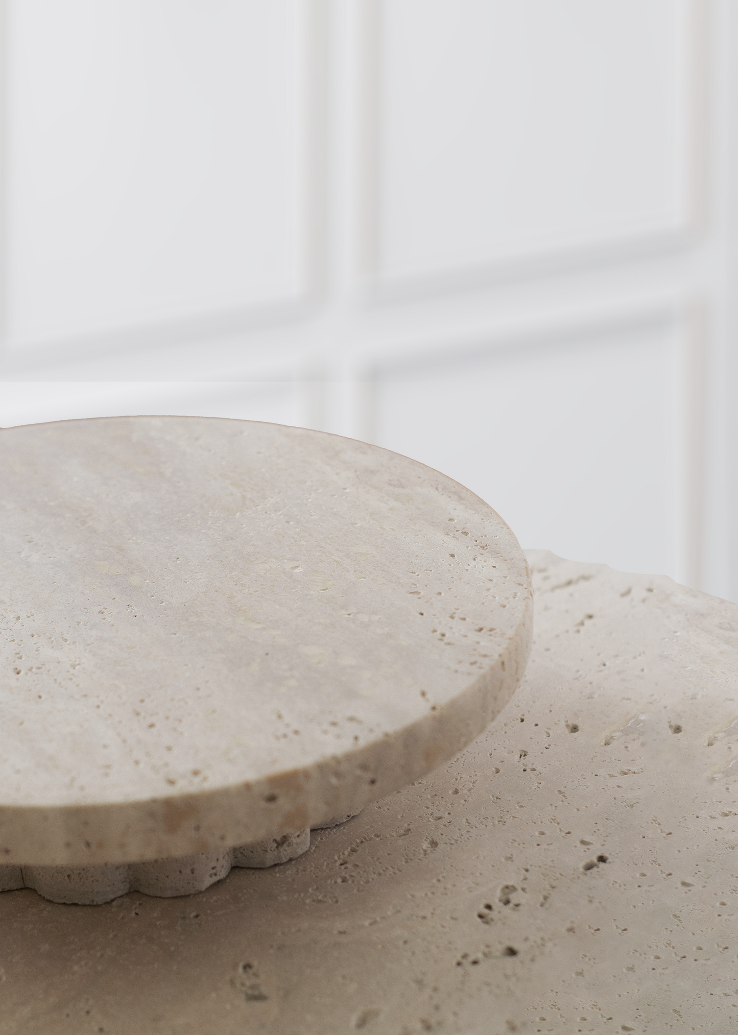 Elegant travertine round tray, perfect for displaying candles and organizing small items on coffee tables or dining spaces.