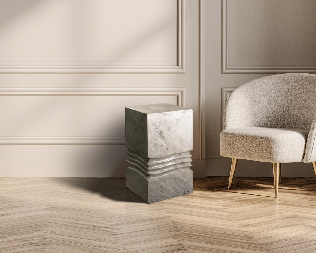 Unique marble side table showcasing its sculpted base and smooth top, adding sophistication to a space.