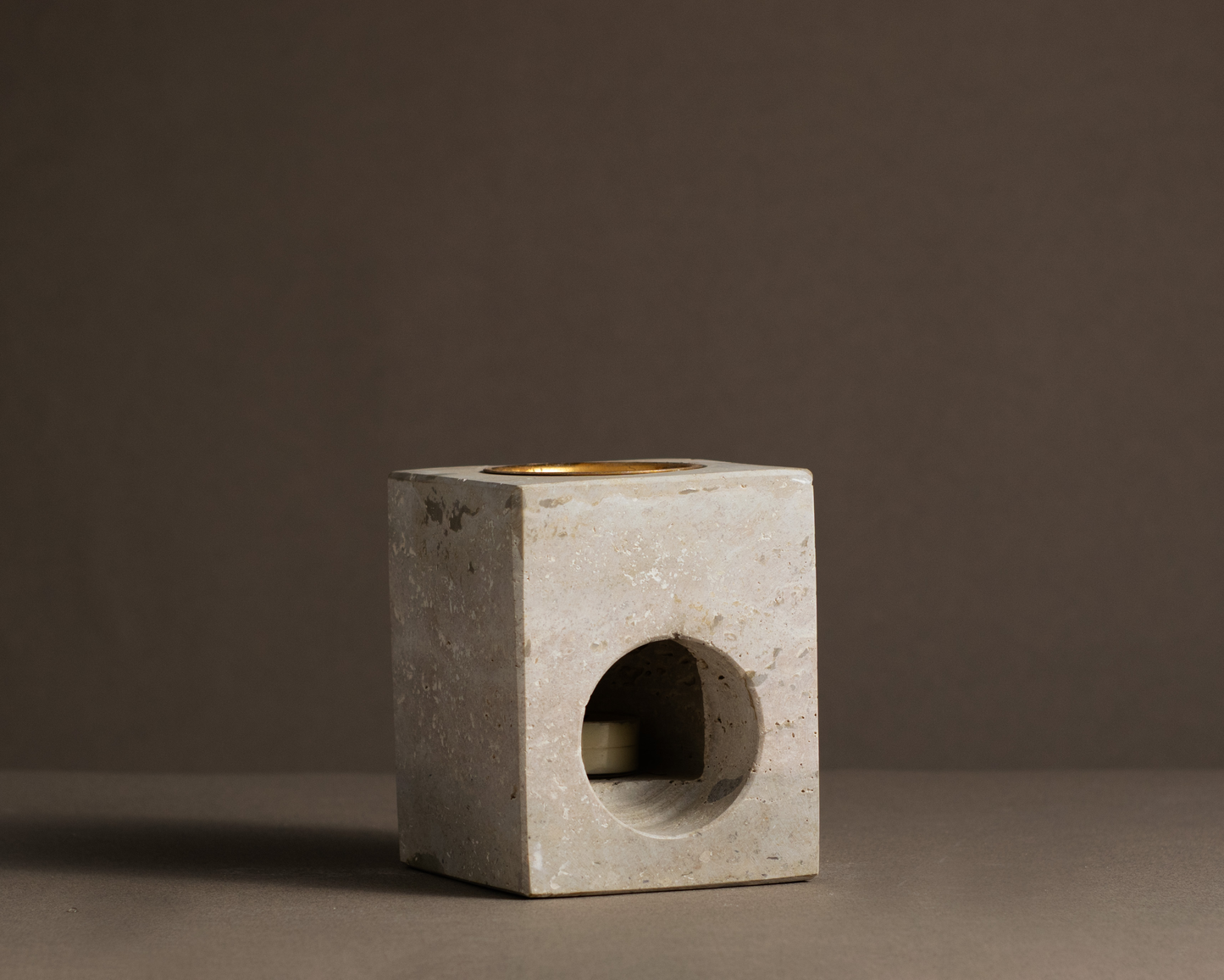 Serene Tealight Oil Burner made from natural travertine, showcasing unique veining and earthy tones for a calming atmosphere