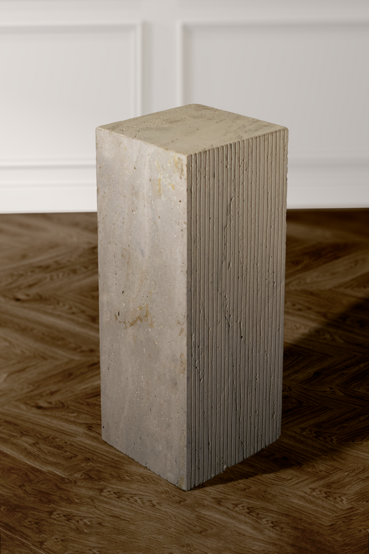 Unique travertine display plinth with a contemporary design, showcasing the natural beauty and texture of the stone.