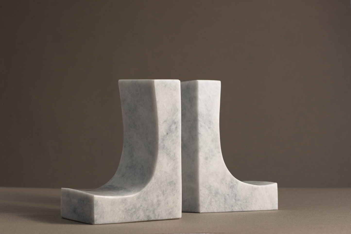 Handcrafted Ascend White Marble Bookends featuring a polished surface and natural veining, adding a touch of luxury to your space.