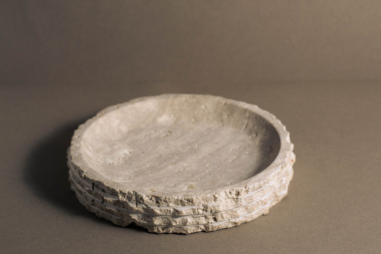 One-of-a-kind travertine round bowl, hand-carved and polished for home décor.