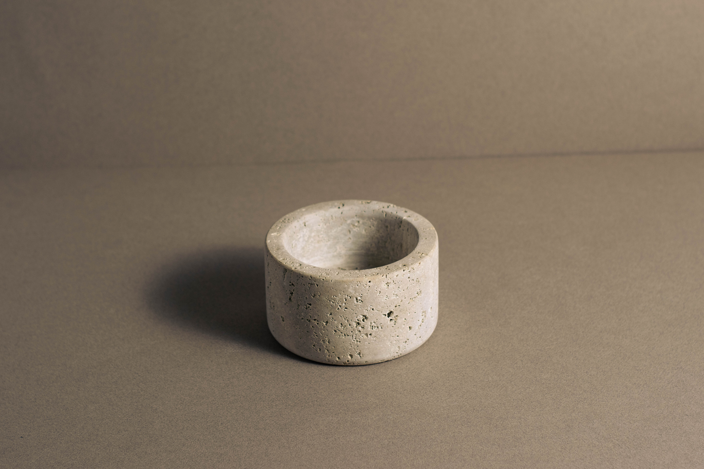 Durable small salad bowl made from high-quality travertine, featuring a smooth surface and natural stone elegance.