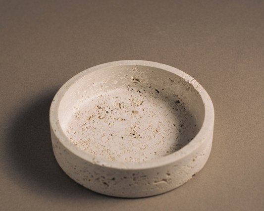 "Orb travertine bowl with refined design and warm, earthy tones."
