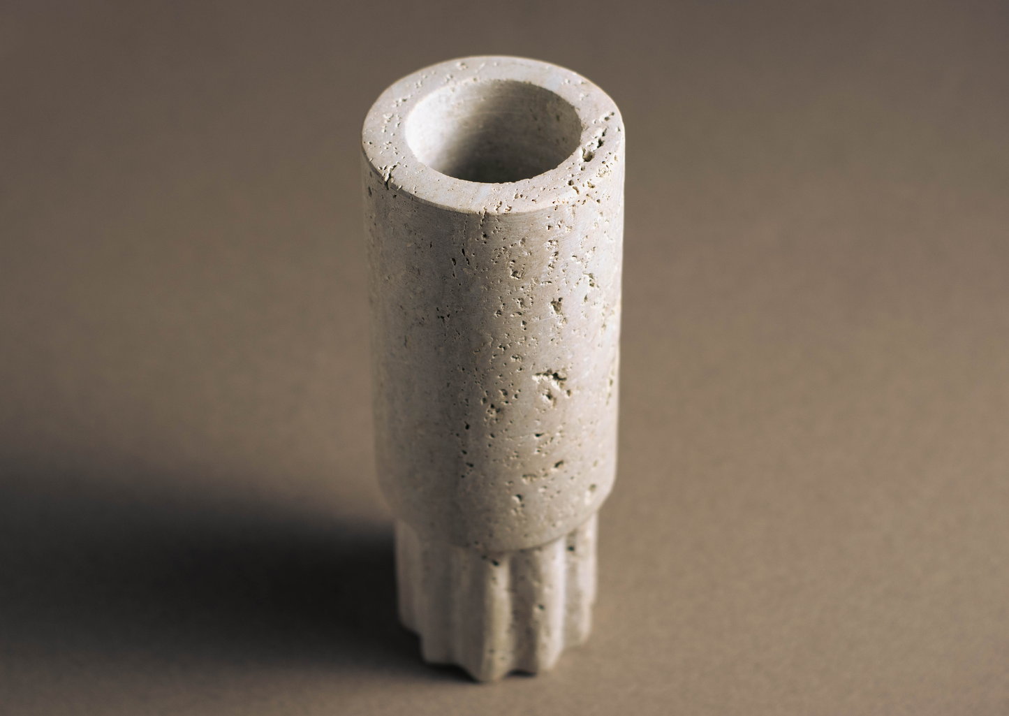 Beautifully crafted Travertine Column Vase showcasing natural veining and intricate details.
