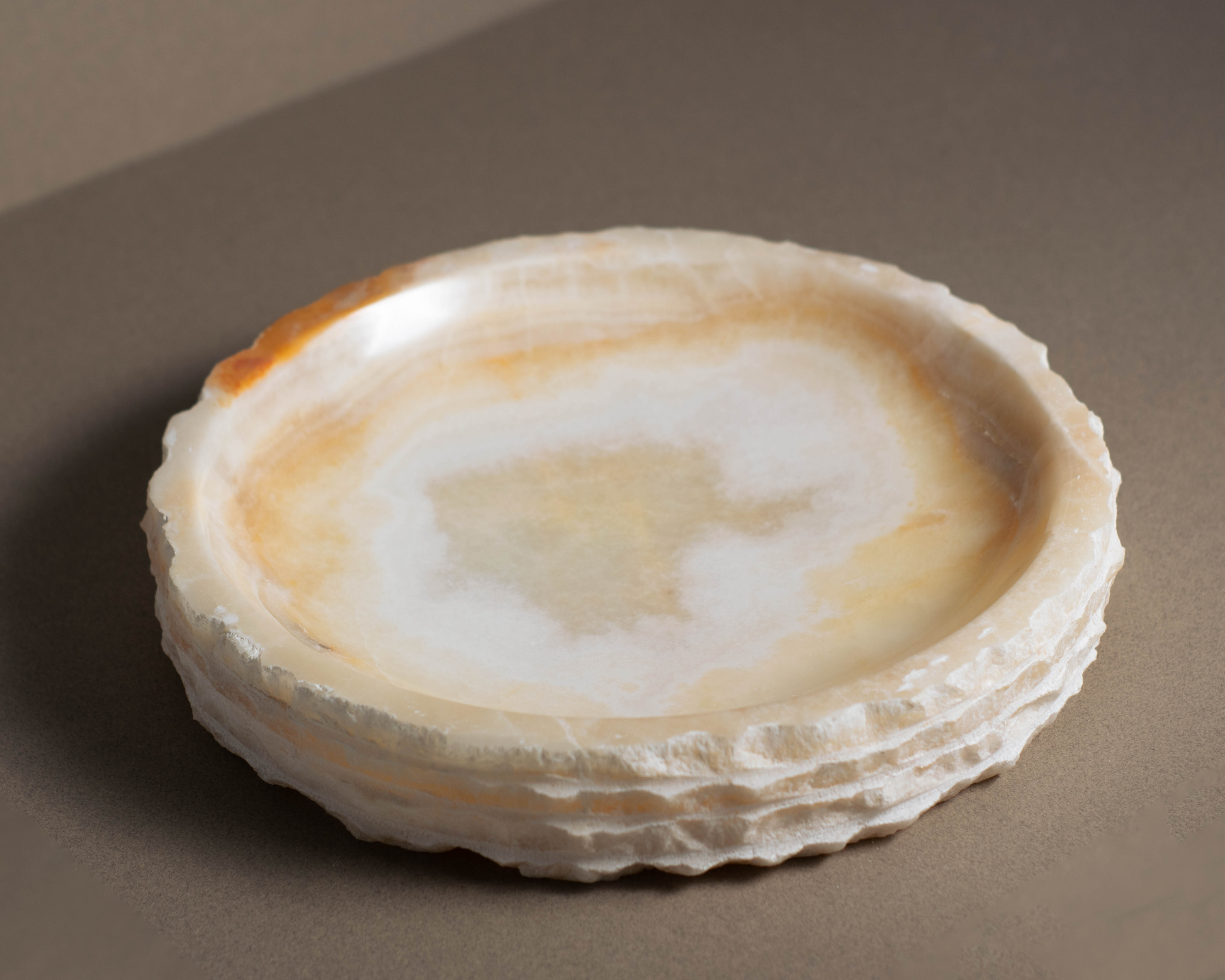 "Elegant decorative accent piece made from premium white onyx."
