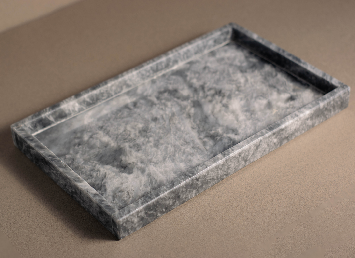 Sleek grey marble décor tray adding elegance to a classic living room.