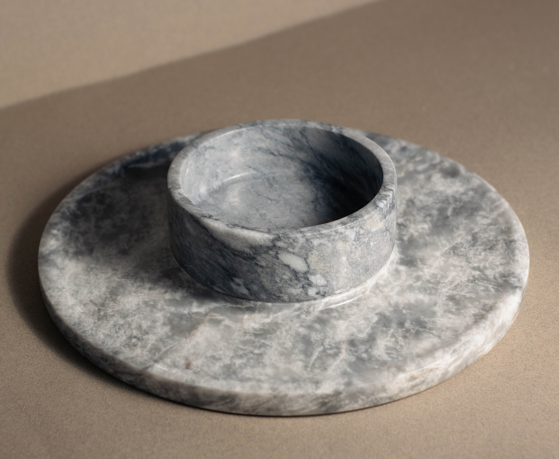 Elegant grey marble cheese platter with a polished surface, perfect for serving cheese and charcuterie at stylish gatherings.