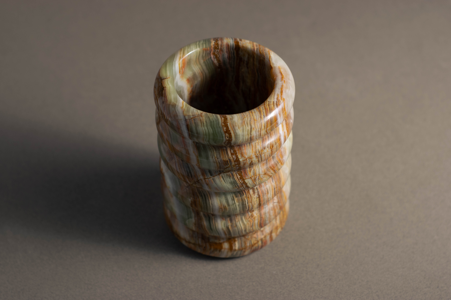 Natural stone vase featuring ocean-inspired curves, adding sophistication to home decor.