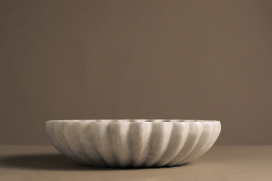 Handcrafted marble bowl with coral-inspired design, showcasing unique veining and elegant textures for home decor.