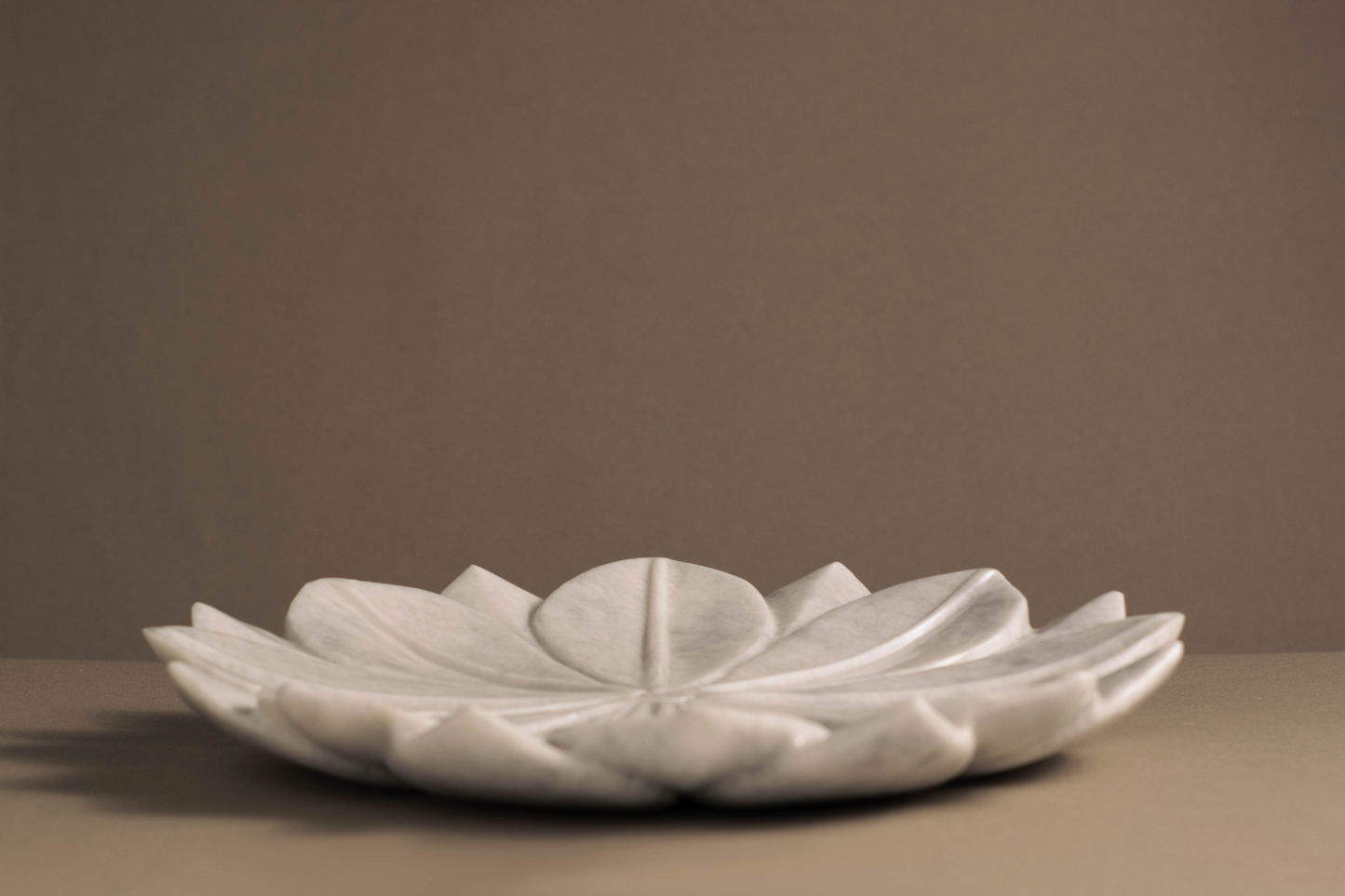 Versatile and stylish Lotus Charger Plate in White Marble, ideal for special occasions and everyday meals.