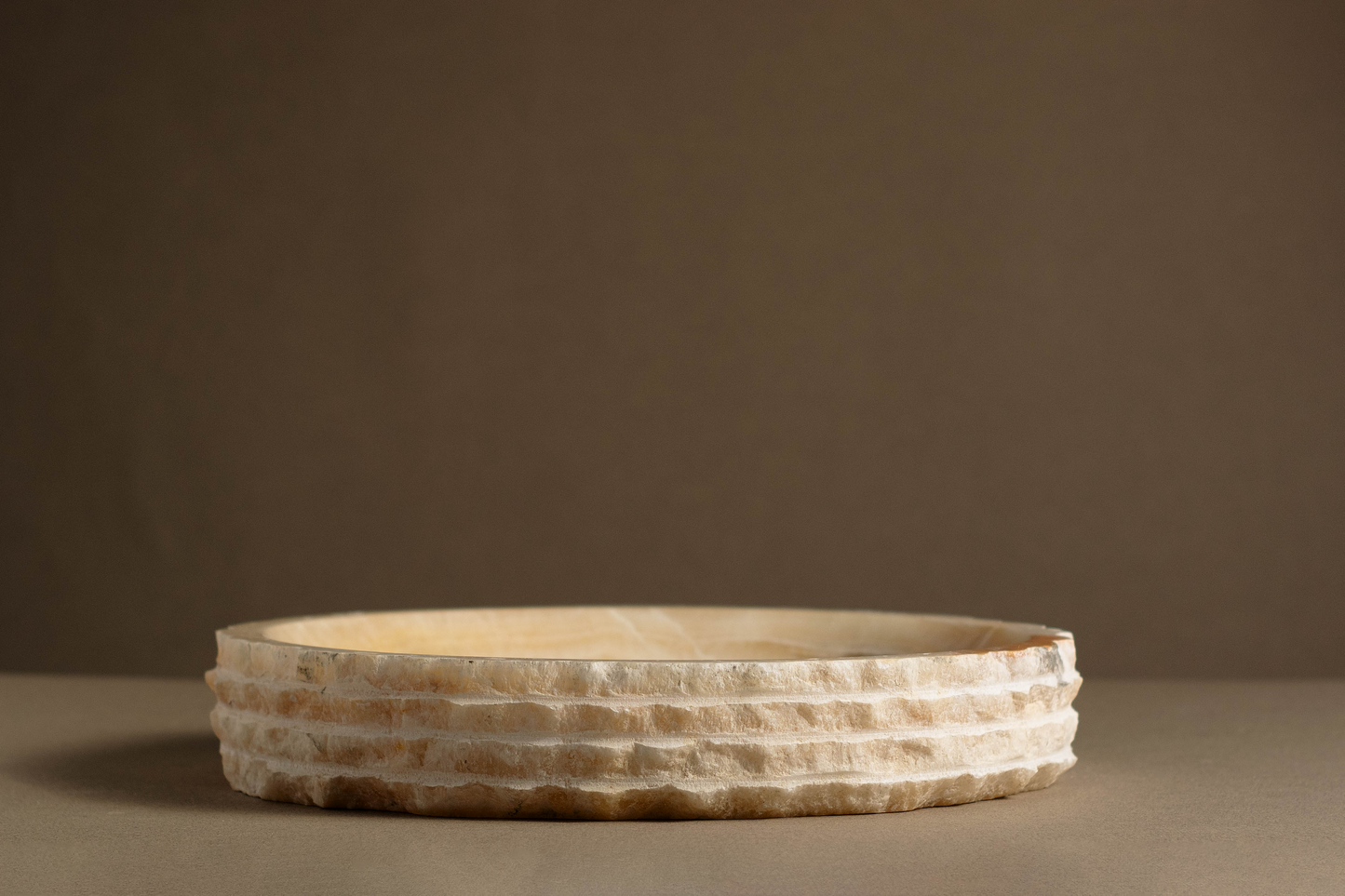 "Hand-carved Eclipse Round Bowl in white onyx for luxury home décor."
